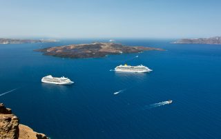 cruise ship near volcano on island of Santorini